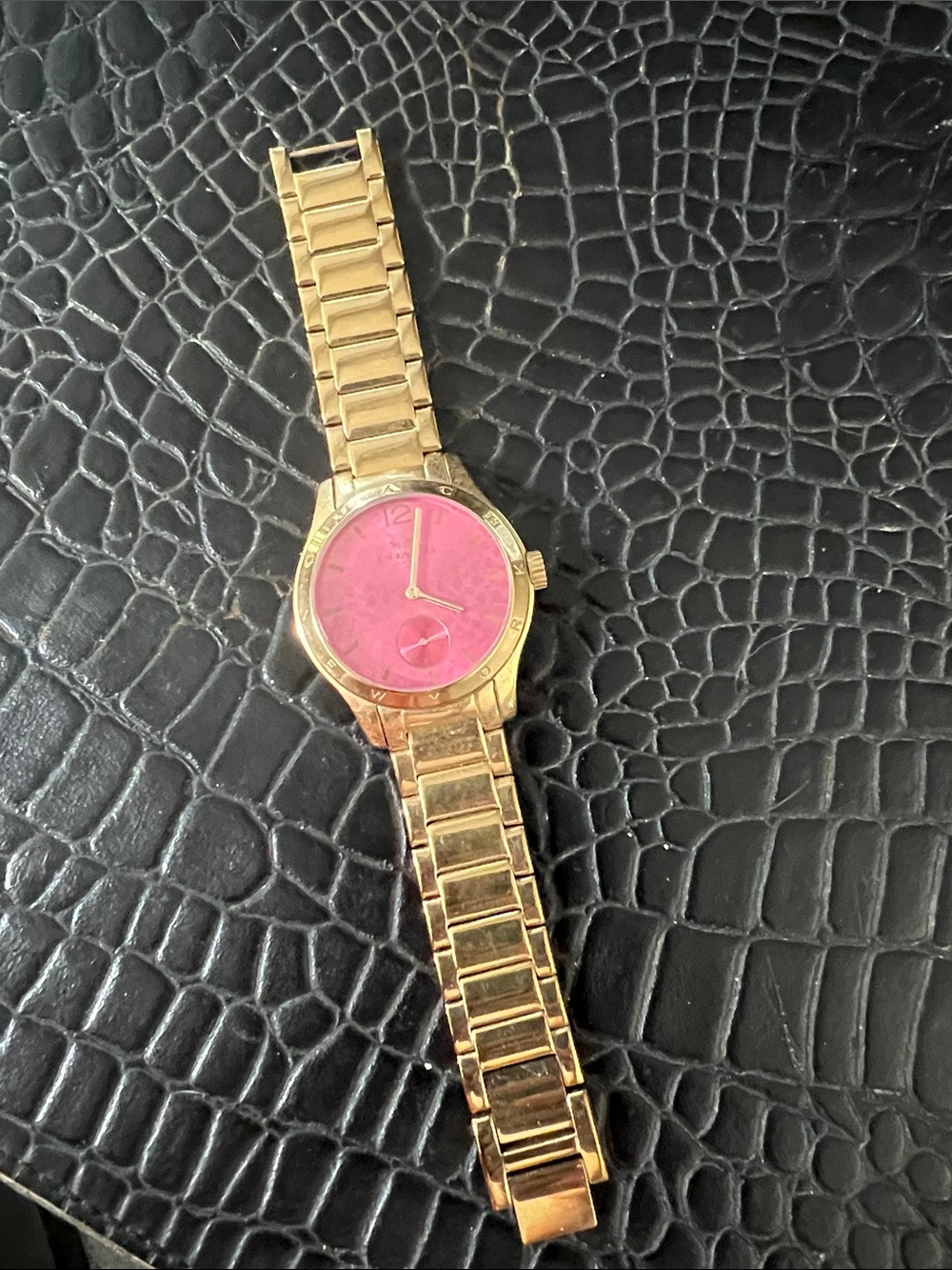Coach gold watch; Metal Band with pink signature face